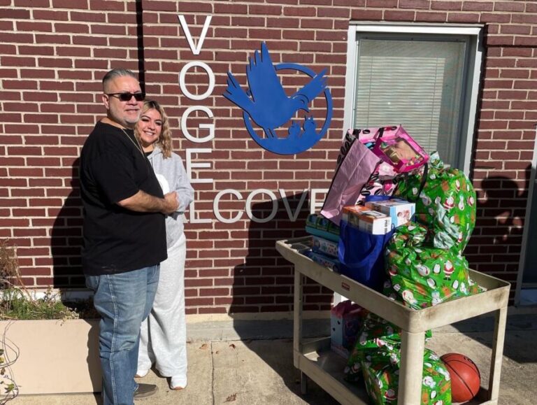 Volunteers with toys in front of Vogel